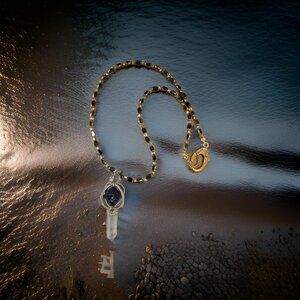 Lapis and Crystal Point Spinner Necklace in black/gold